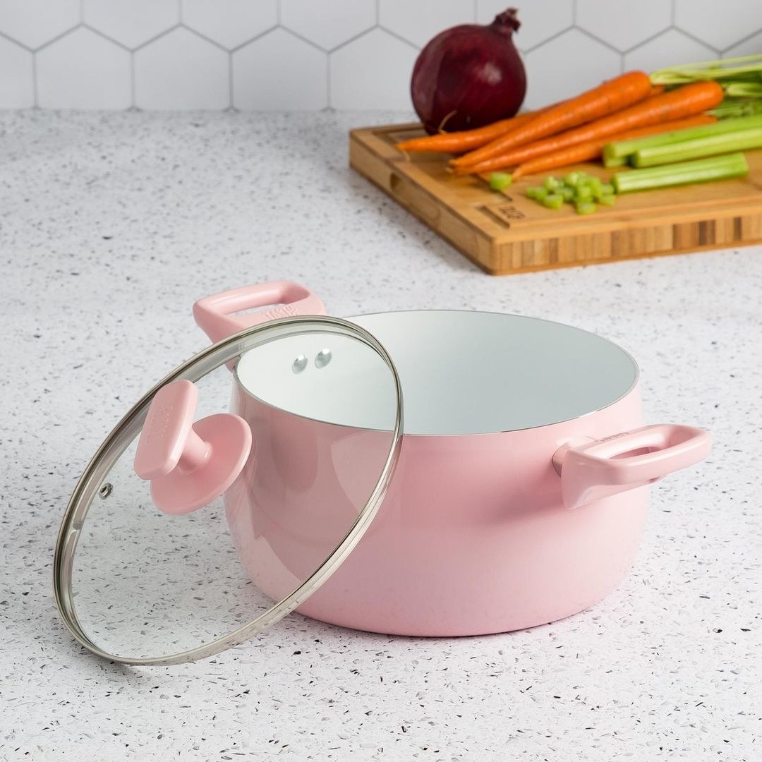 A large stock pot and lid on a counter