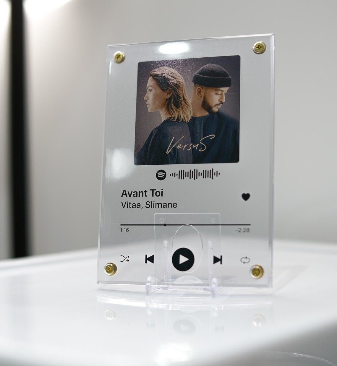 A clear plaque with the Spotify image of a song on it 