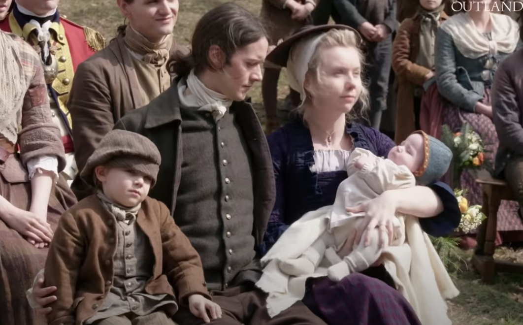 Marsali and Fergus with their two kids at Brianna&#x27;s wedding