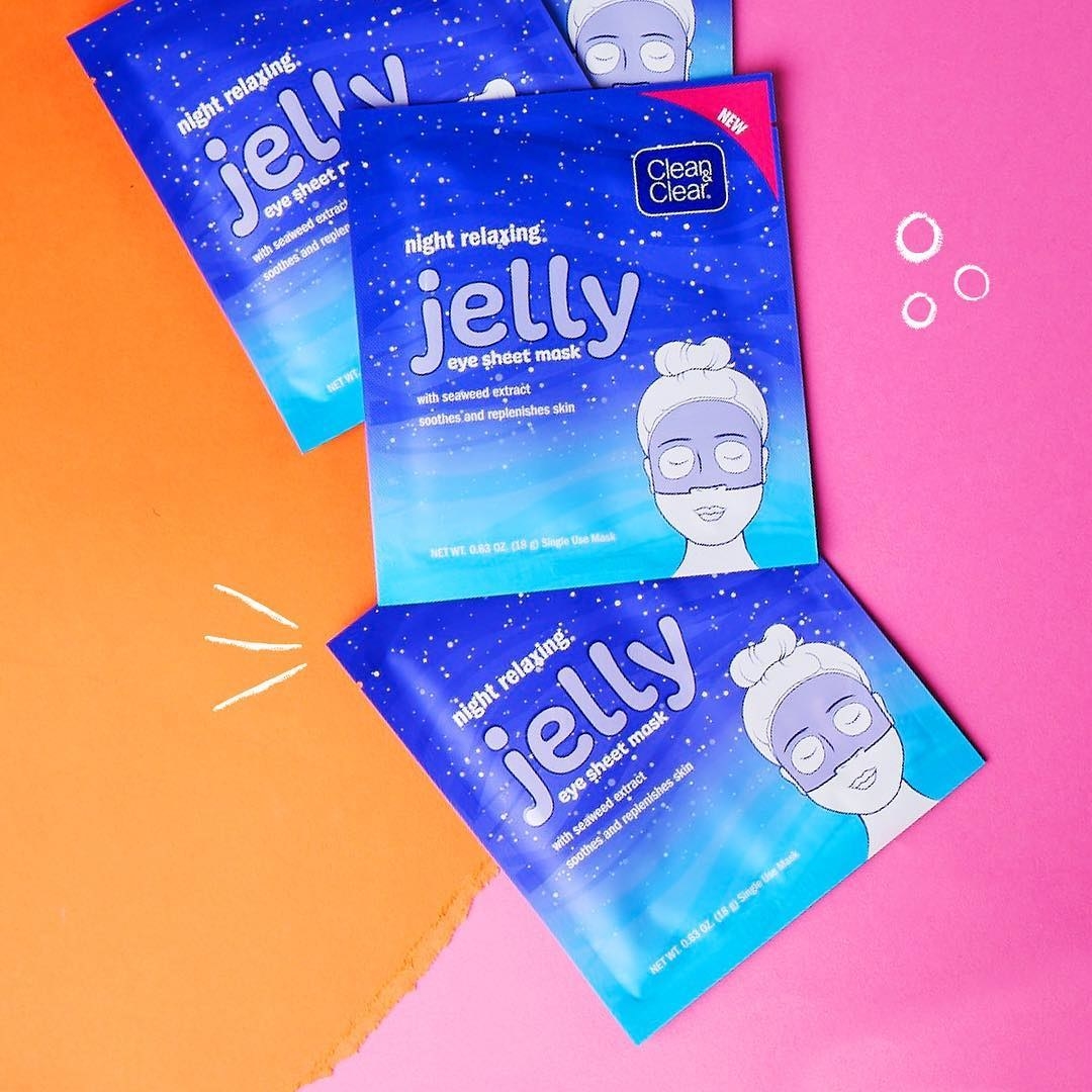 Three sheet masks in packaging on a plain background
