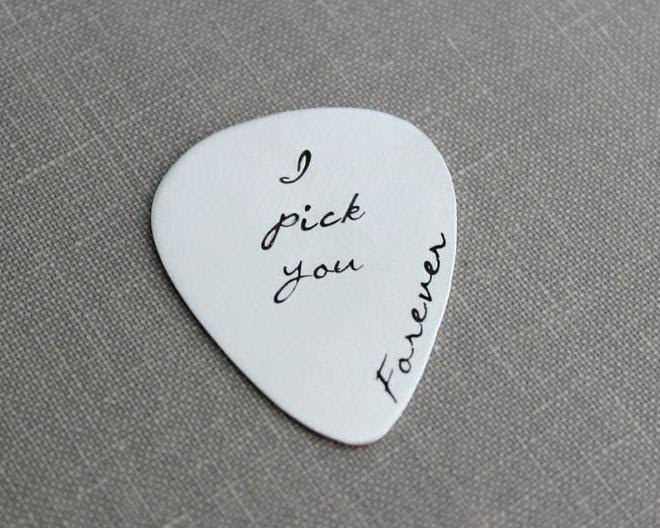 a white guitar pick that has &quot;I pick you forever&quot; engraved on it. Get it? I PICK you? So sweet!