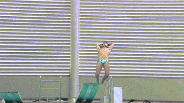 Man diving and falling into pool.