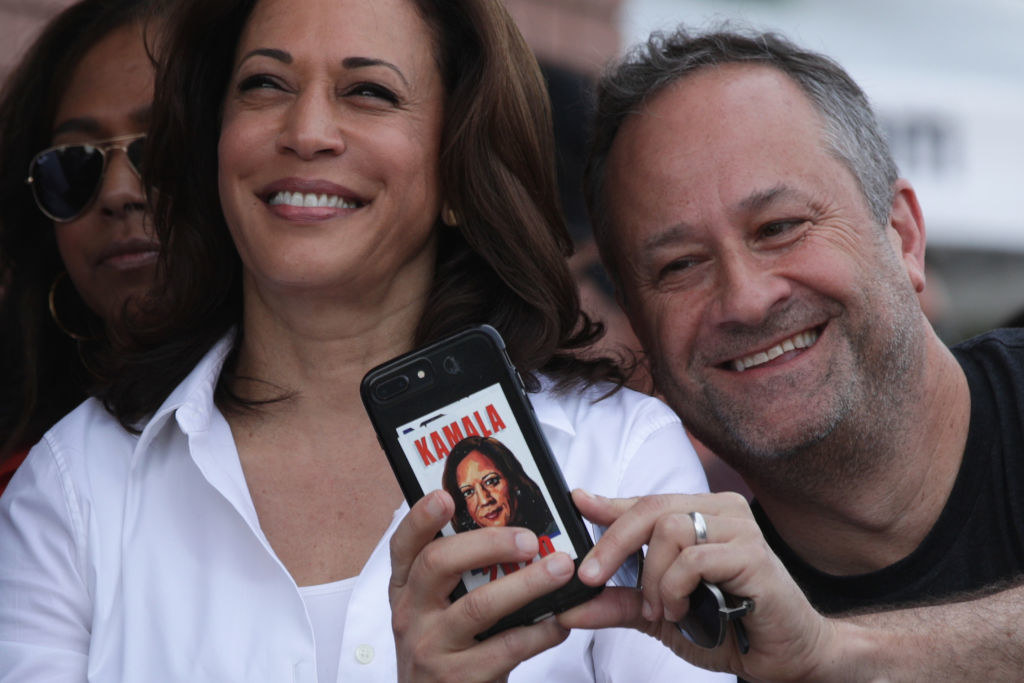 Doug Emhoff taking a selfie next to Vice President Harris