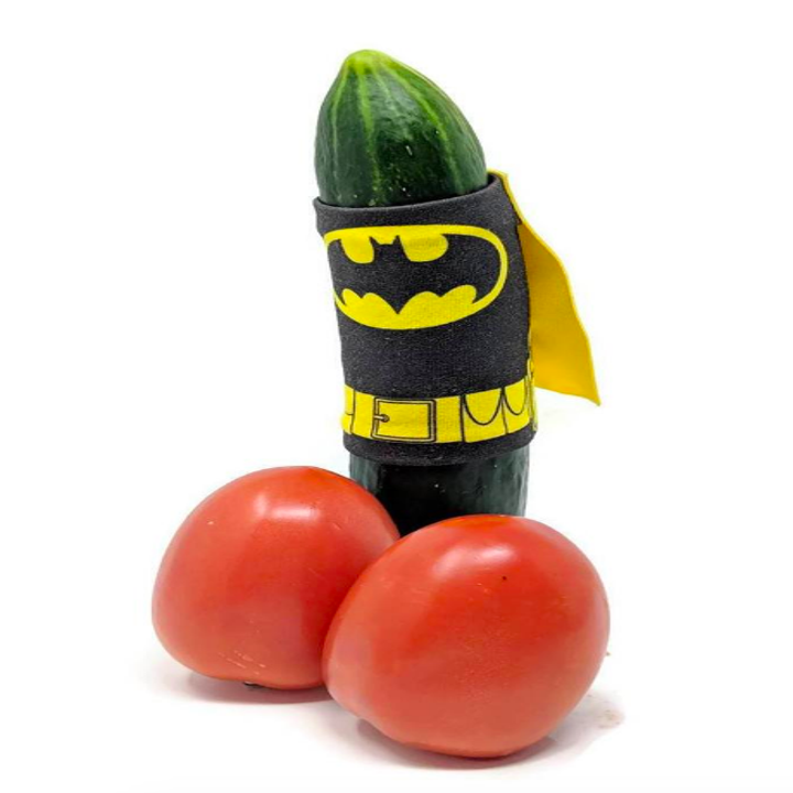 Cucumber wearing a Bateman wrap and cape