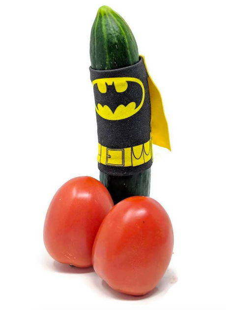Cucumber wearing a Bateman wrap and cape