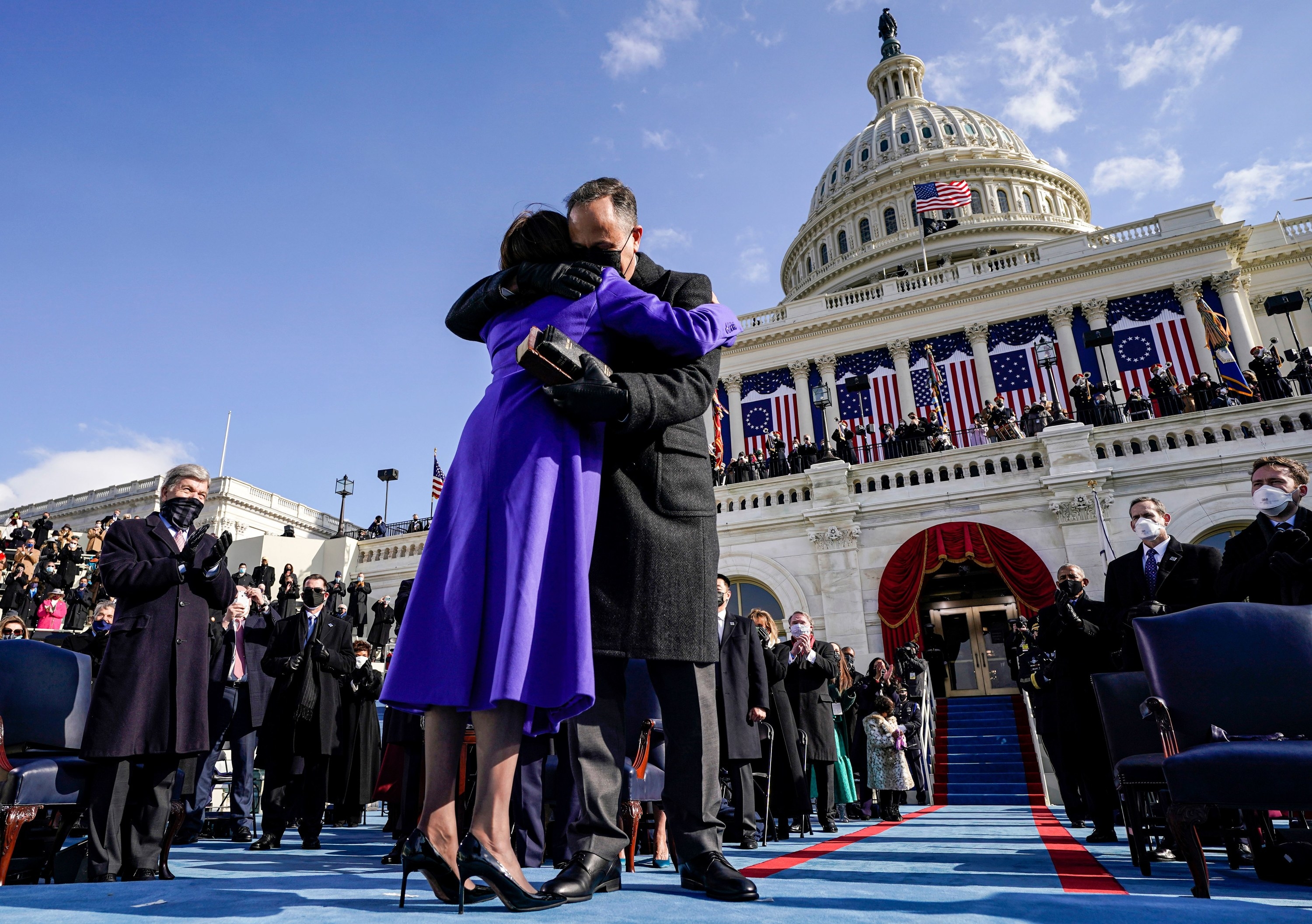 Doug Emhodd hugging his wife after she is sworn in as Vice President