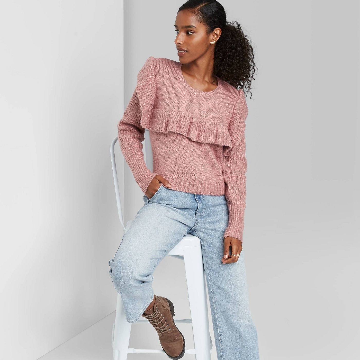 Model in crewneck ruffle sweater