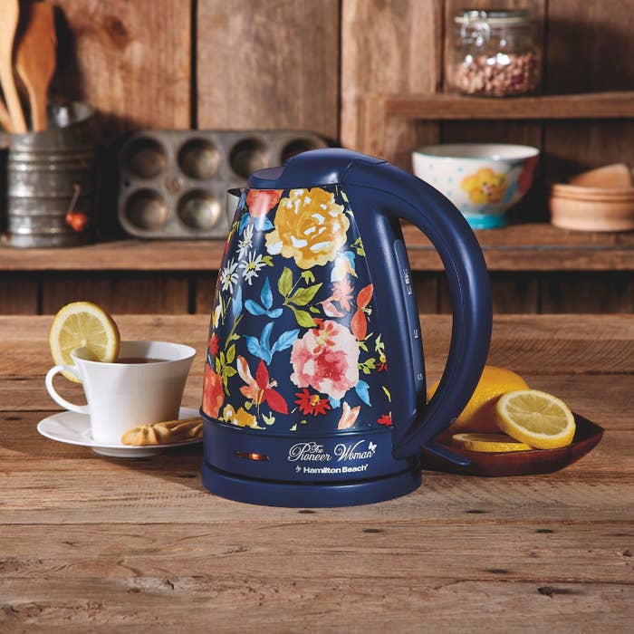 The electric kettle with a blue floral pattern in a kitchen