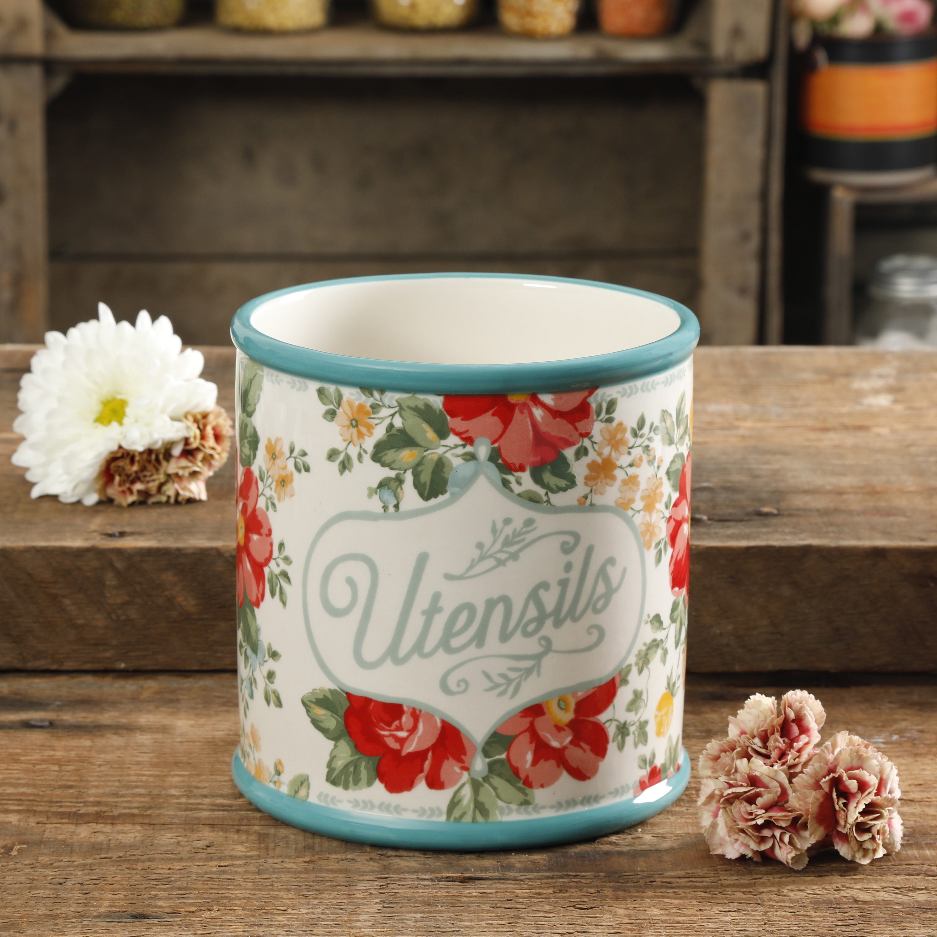 The Pioneer Woman floral kitchen utensil holder sitting on a table