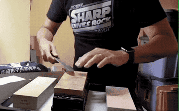 Sharpening a knife on a whetstone 