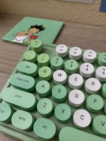 A reviewer's photo of the keyboard in green