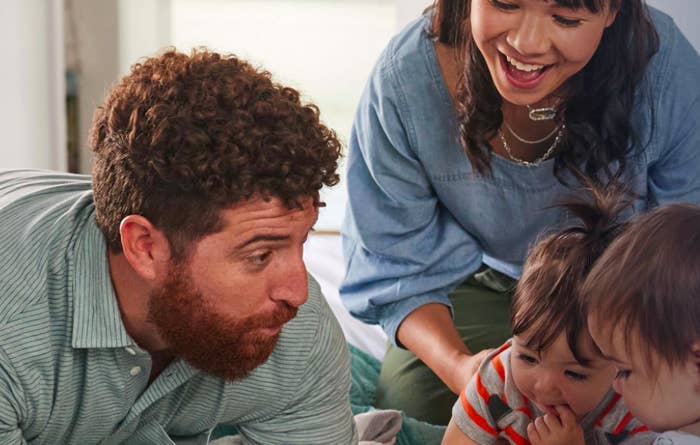 Two parents playing with two children