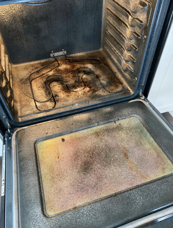 the inside of a reviewer's oven looking dirty