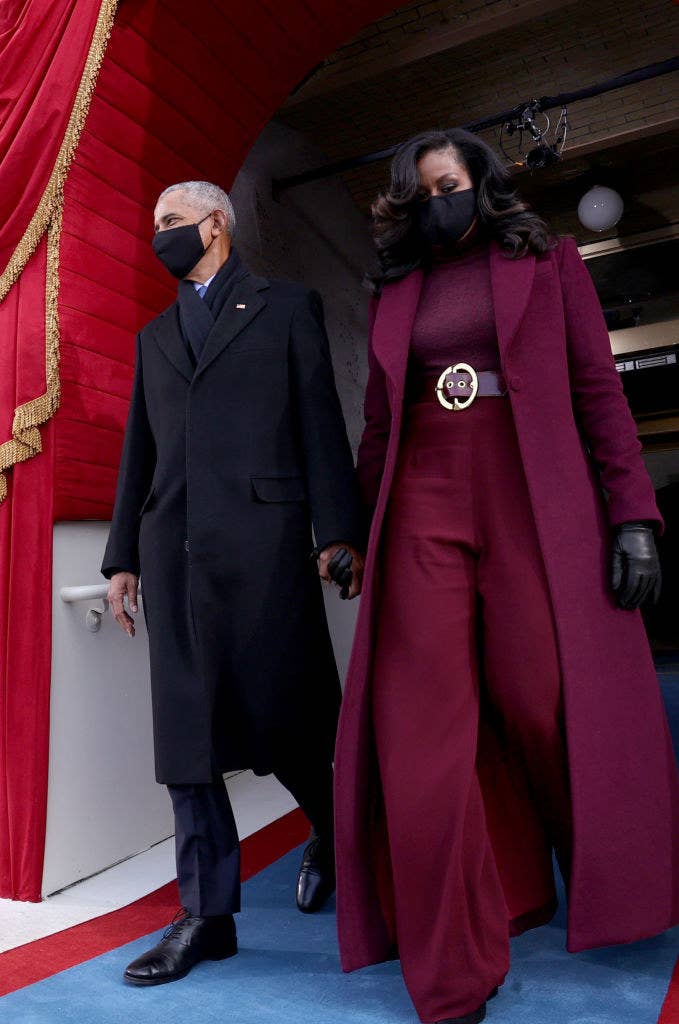 Former US President Barack Obama and wife Michelle Obama arrive for the inauguration of President-elect Joe Biden, with Michelle in her iconic designer suit