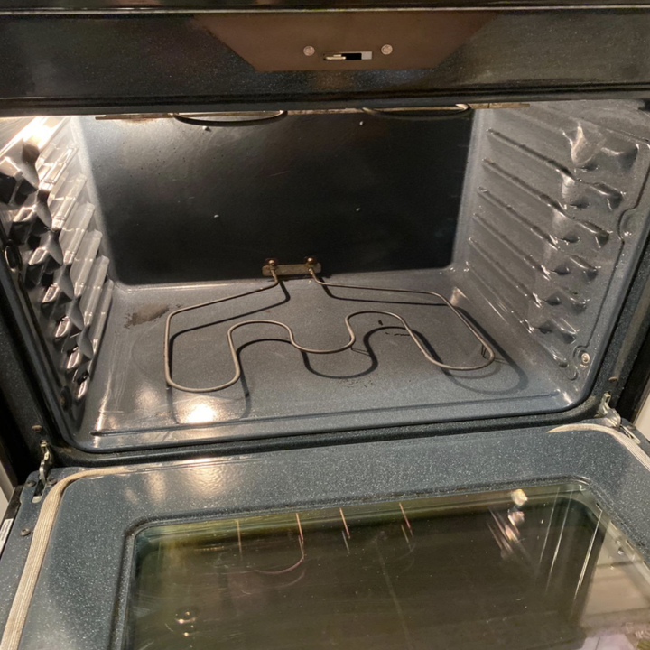 the same oven now looking clean after using the spray