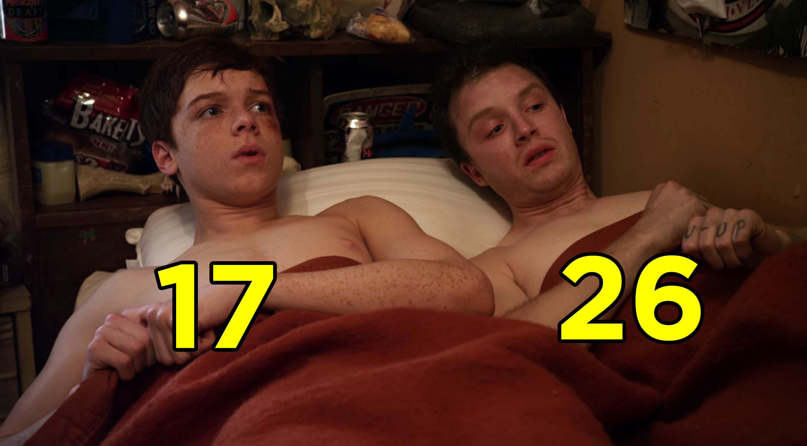 Cameron Monoghan and Noel Fisher in bed shirtless from a scene from &quot;Shameless&quot;