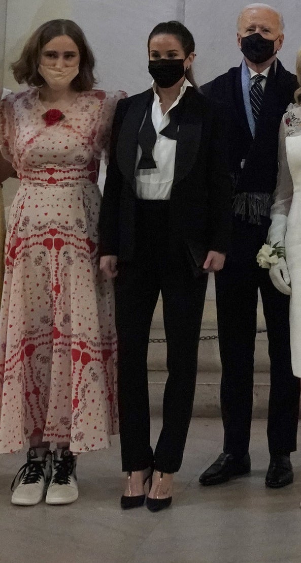 Ashely Biden posing in a mask next to President Joe Biden