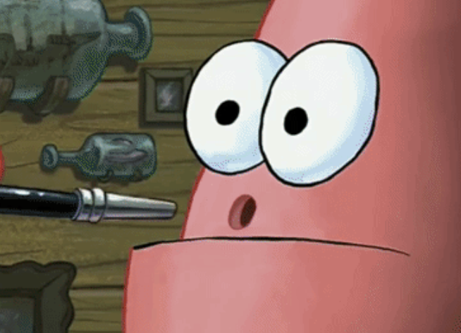 Patrick inserts the paintbrush into a large hole where his nose should be.