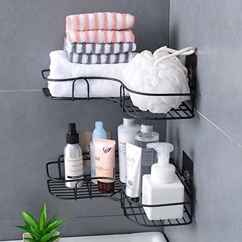 Black metal corner racks with toiletries and towels.
