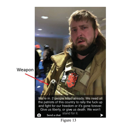 Selfie of a man in a tactical vest with an arrow pointing to a weapon on his person. His caption says &quot;We&#x27;re in,&quot; &quot;We need all the patriots of this country to rally the fuck up and fight for our freedom,&quot; and &quot;Give us liberty, or give us death&quot;