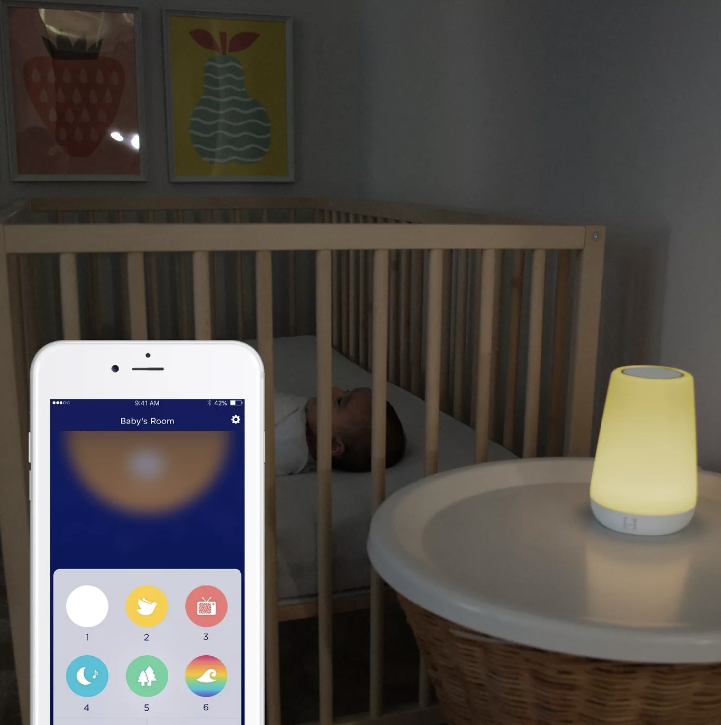 An app on a phone next to a night light