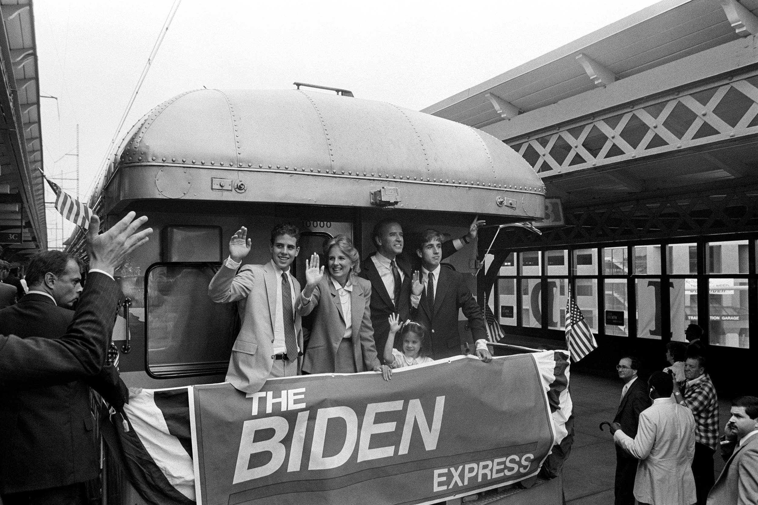 An archival image of the Bidens on a bus in the 80s