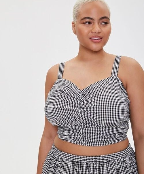 a plus size model in the gingham sweetheart top