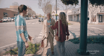Kathryn Newton preemptively stops a man from being pooped on by a bird. 