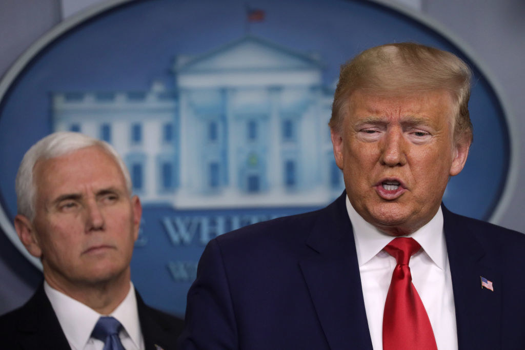 Mike Pence looking on as former President Trump speaks in the White House Press Briefing room