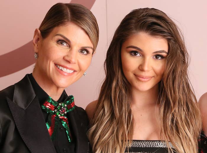 Olivia poses with Lori on a red carpet