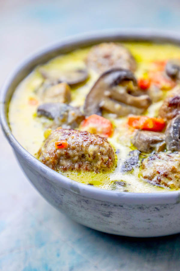 Creamy soup with meatballs, carrots, and mushrooms. 