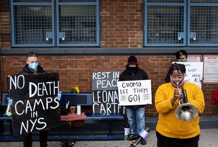 People protest at a vigil outside a prison in New York