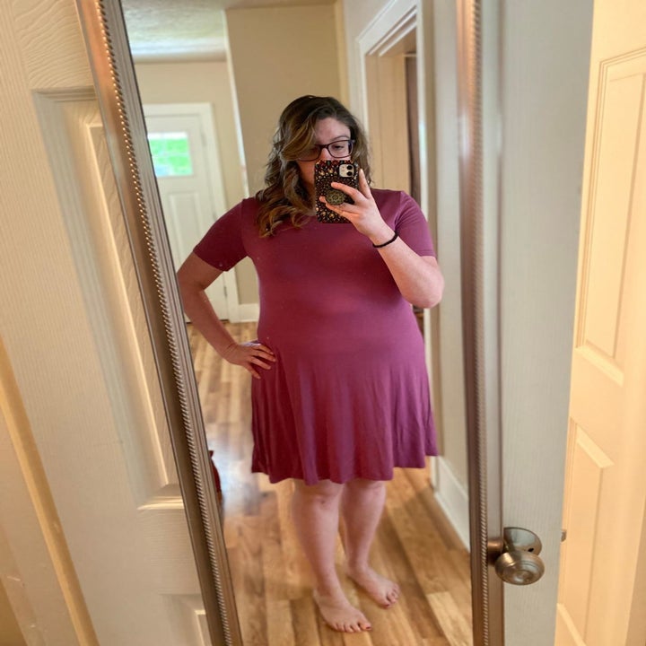 Reviewer wears same style dress in red