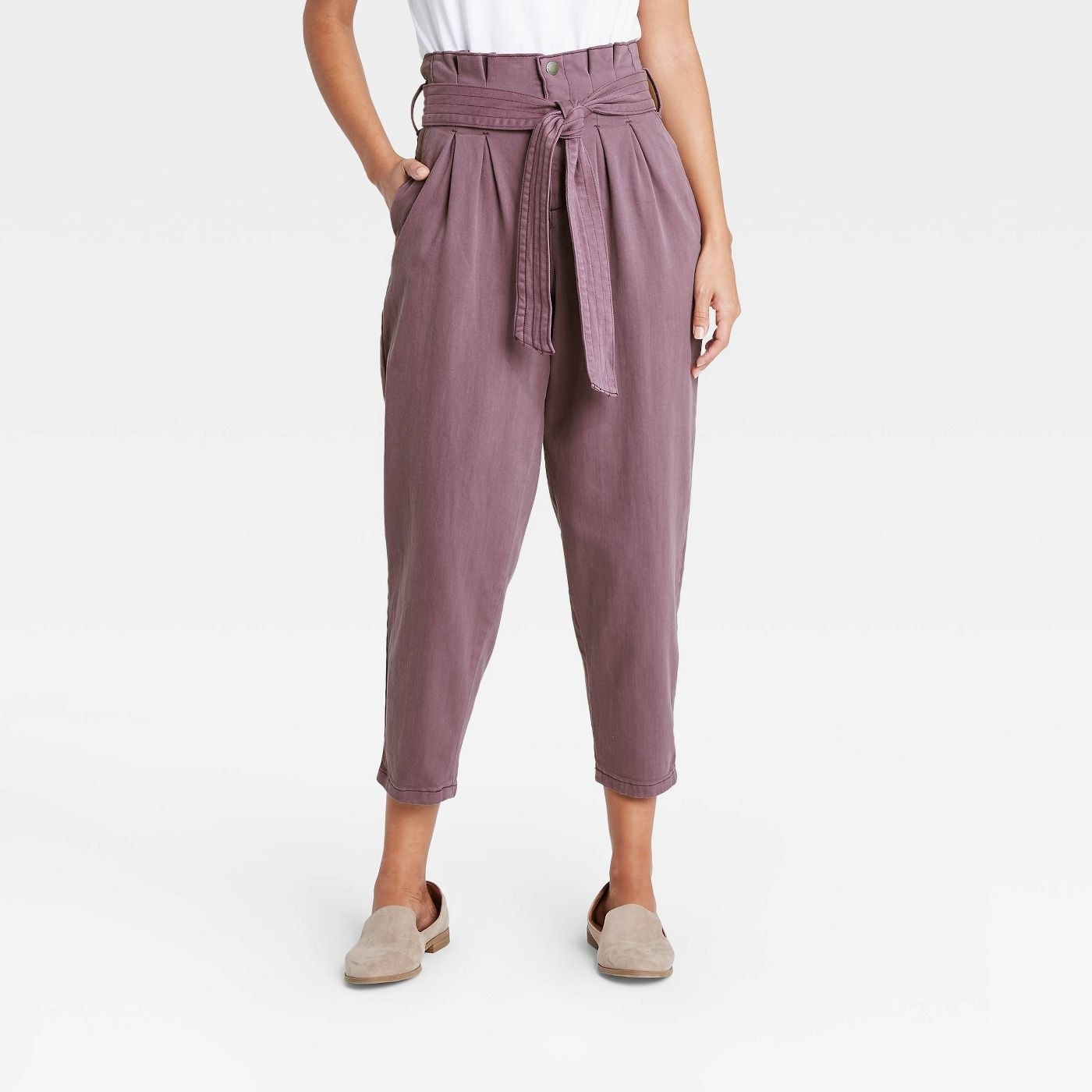 Model in high-rise tapered cropped pants