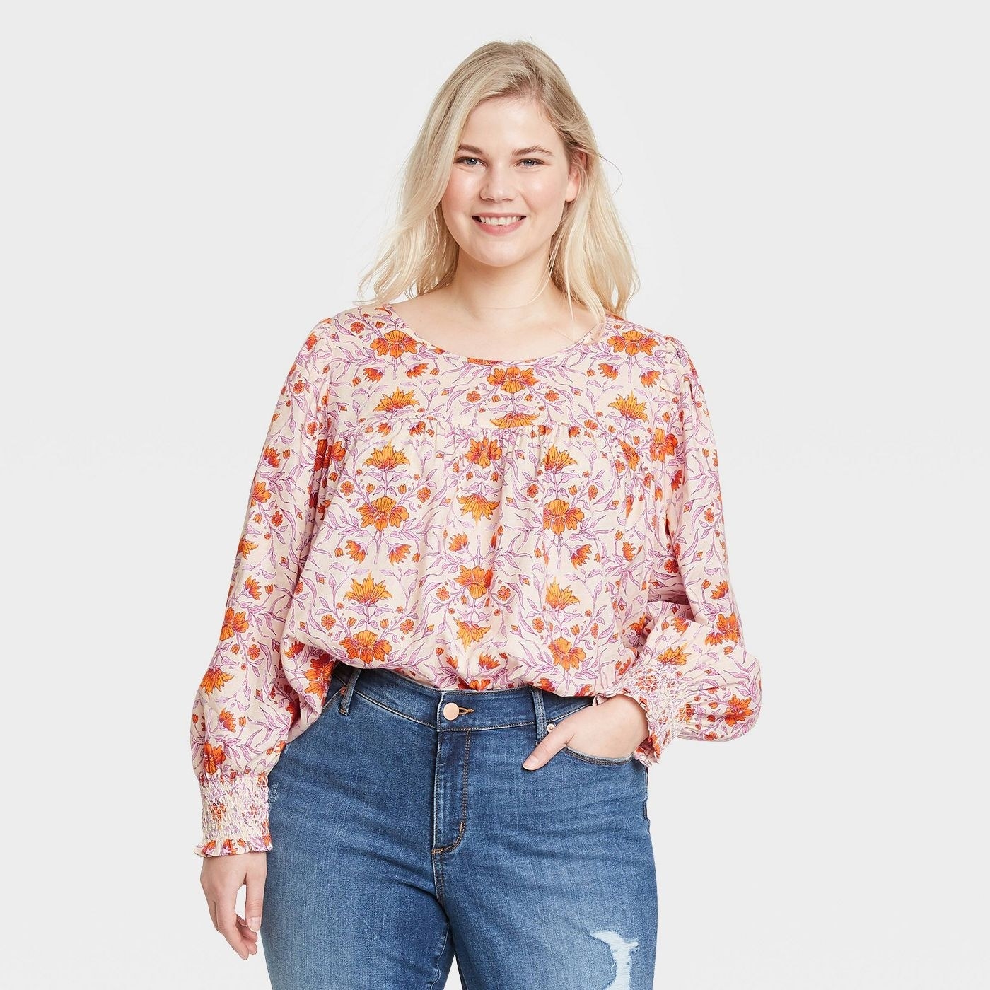 Model in floral balloon sleeve blouse