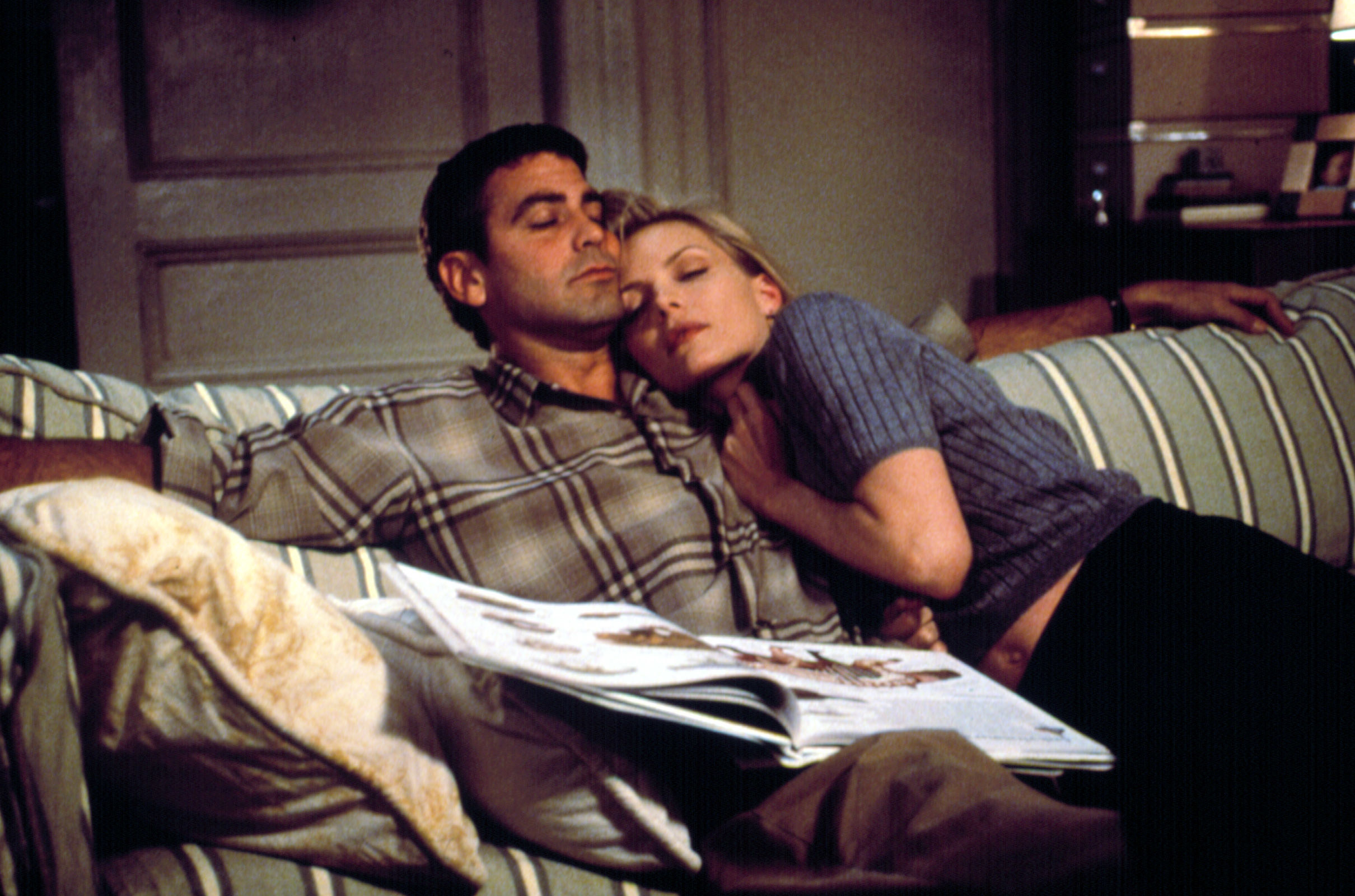 George Clooney Michelle Pfeiffer sleeping on a couch in each other&#x27;s arms