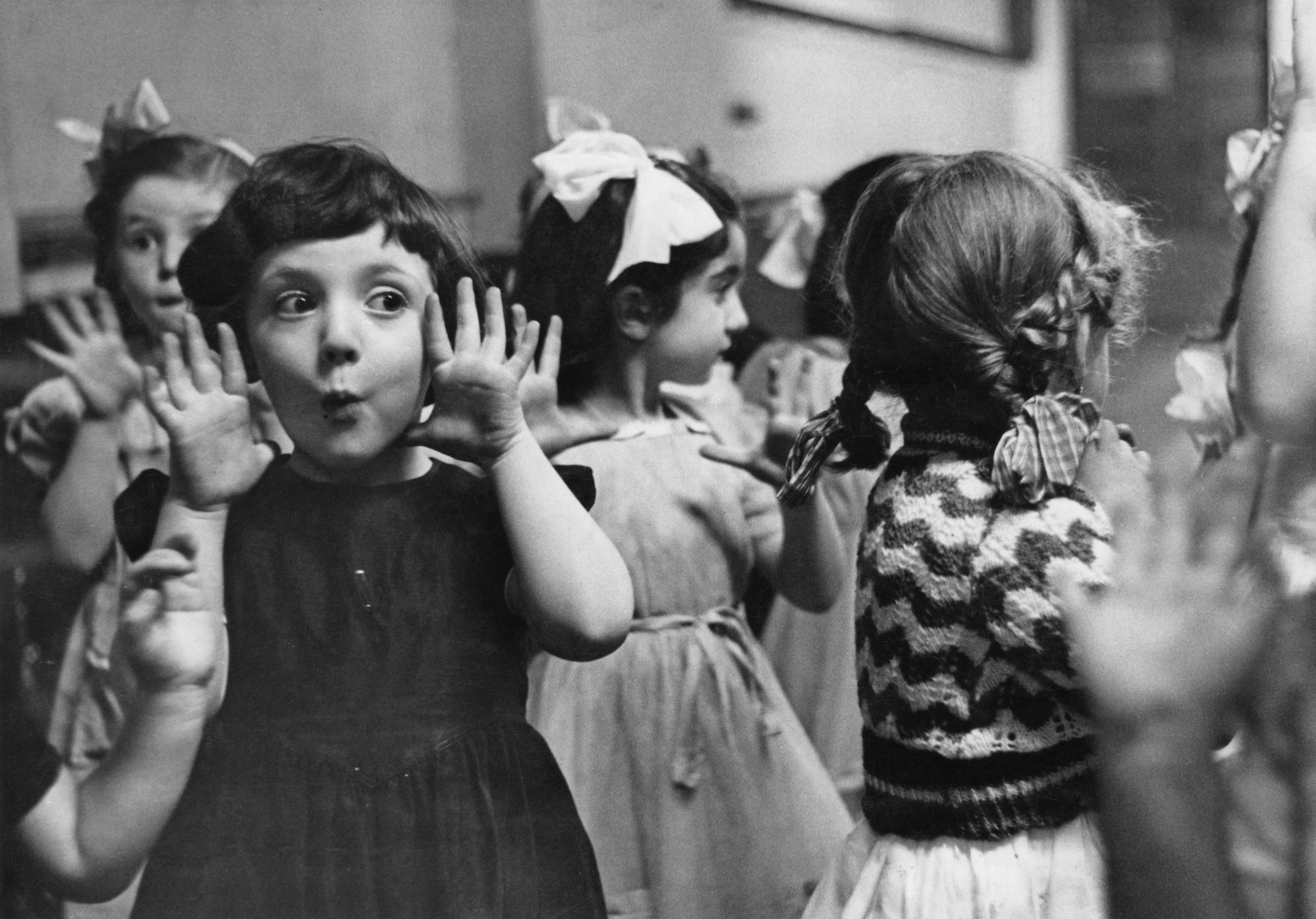 Young girls making faces in a vintage photo 