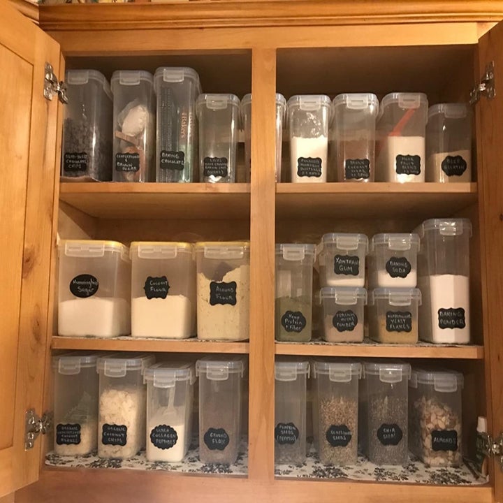 The same cabinet with the foot neatly stored and organized in clear labeled containers