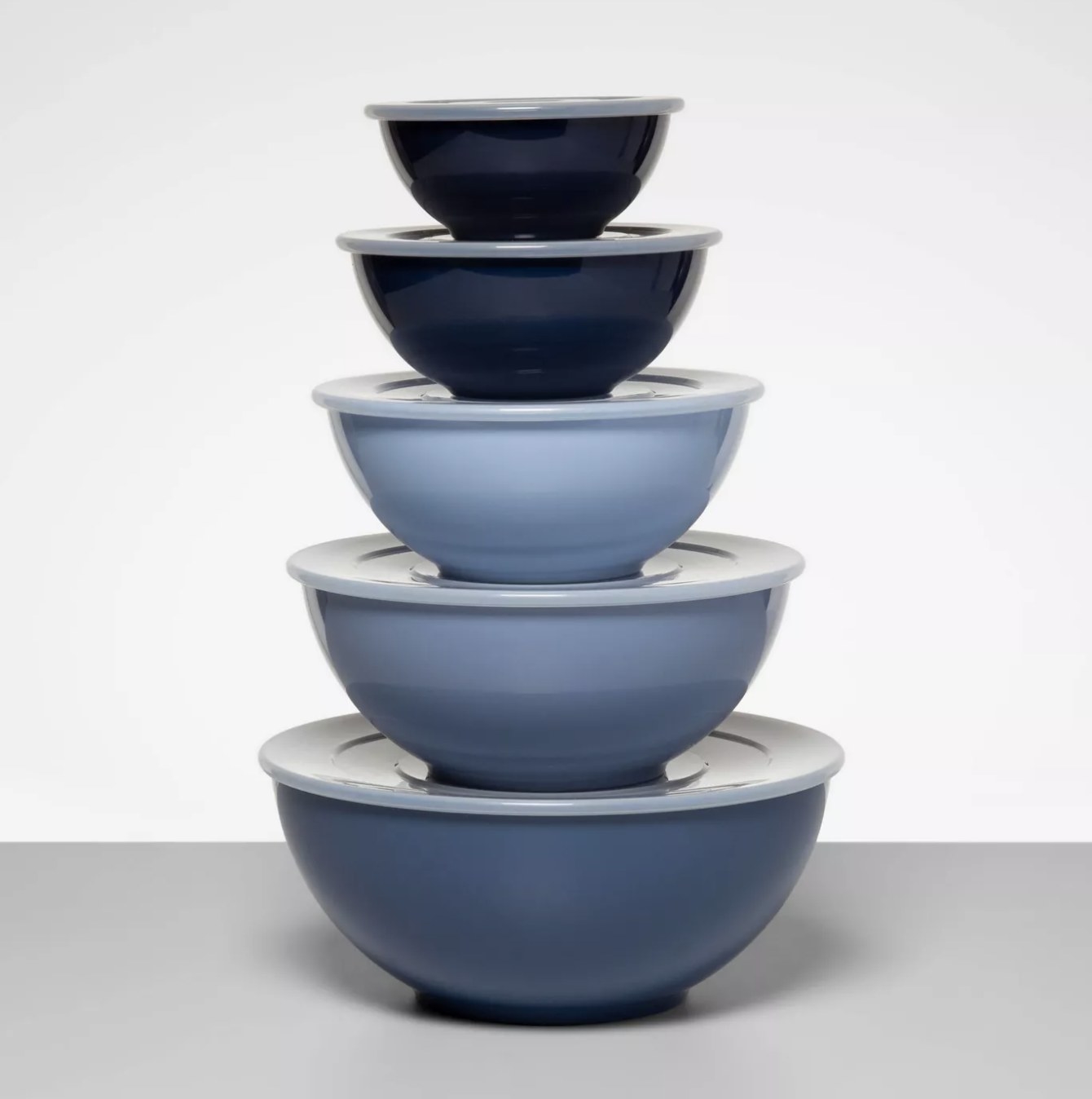 The pale blue mixing bowls stacked with lids