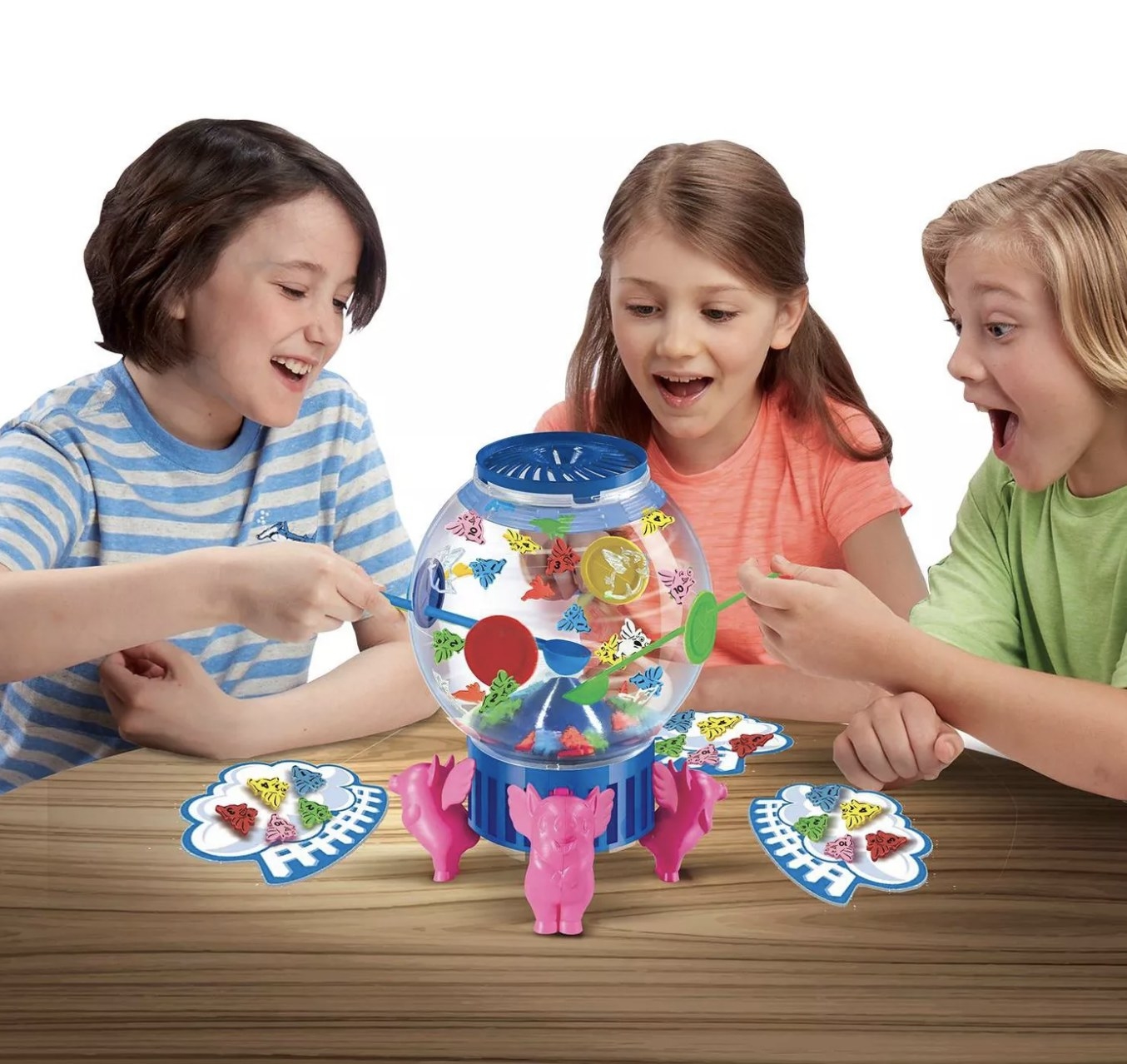 Three young people playing the Flying Pigs game