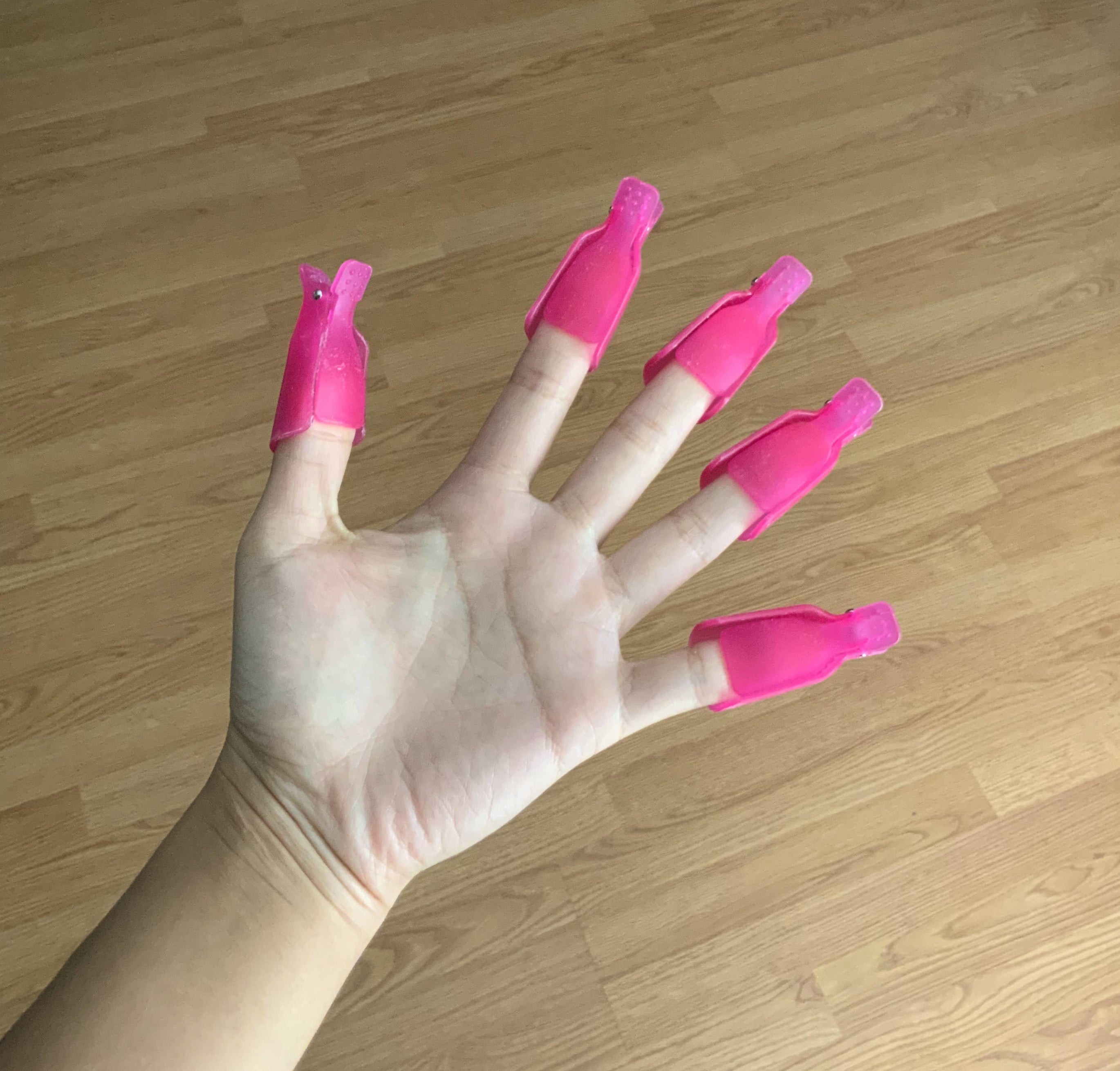 person with nail clips on