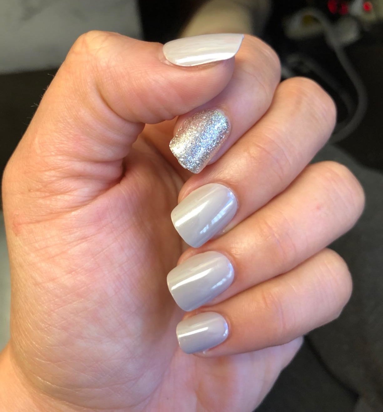 Reviewer with press-on nails