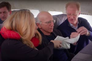 Three people in a row of seats on a plane