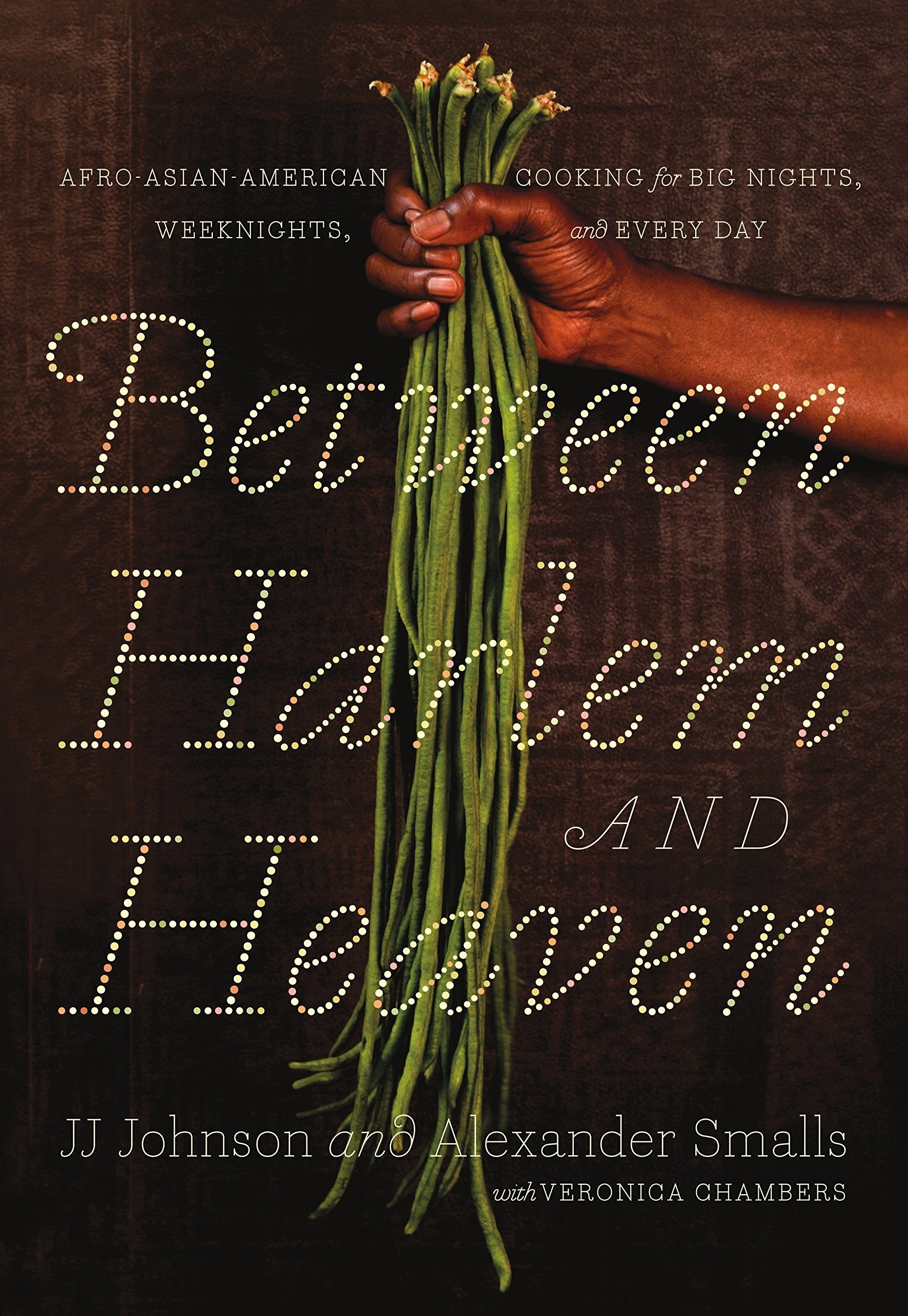 The cover of the book which shows a hand holding greens