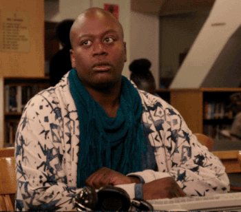 Tituss Burgess rolls his eyes before turning back to face his computer and putting on his headphones on &quot;Unbreakable Kimmy Schmidt&quot;