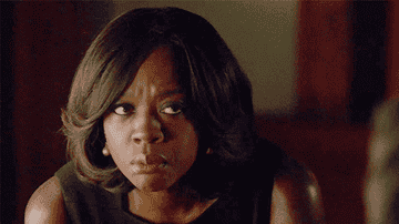 Annalise Keating raises her eyebrows and tilts her head as she gives someone a disbelieving look on How To Get Away With Murder