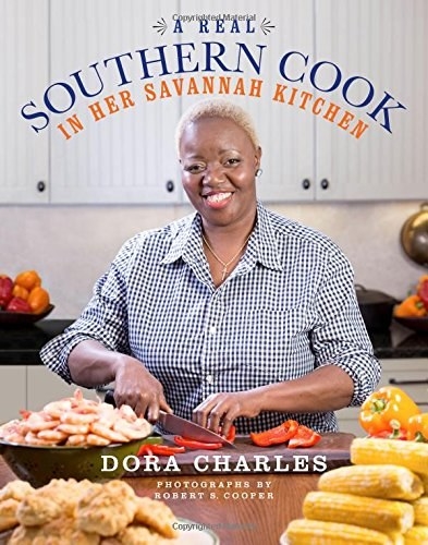 The cover of the book featuring author and chef Dora Charles 