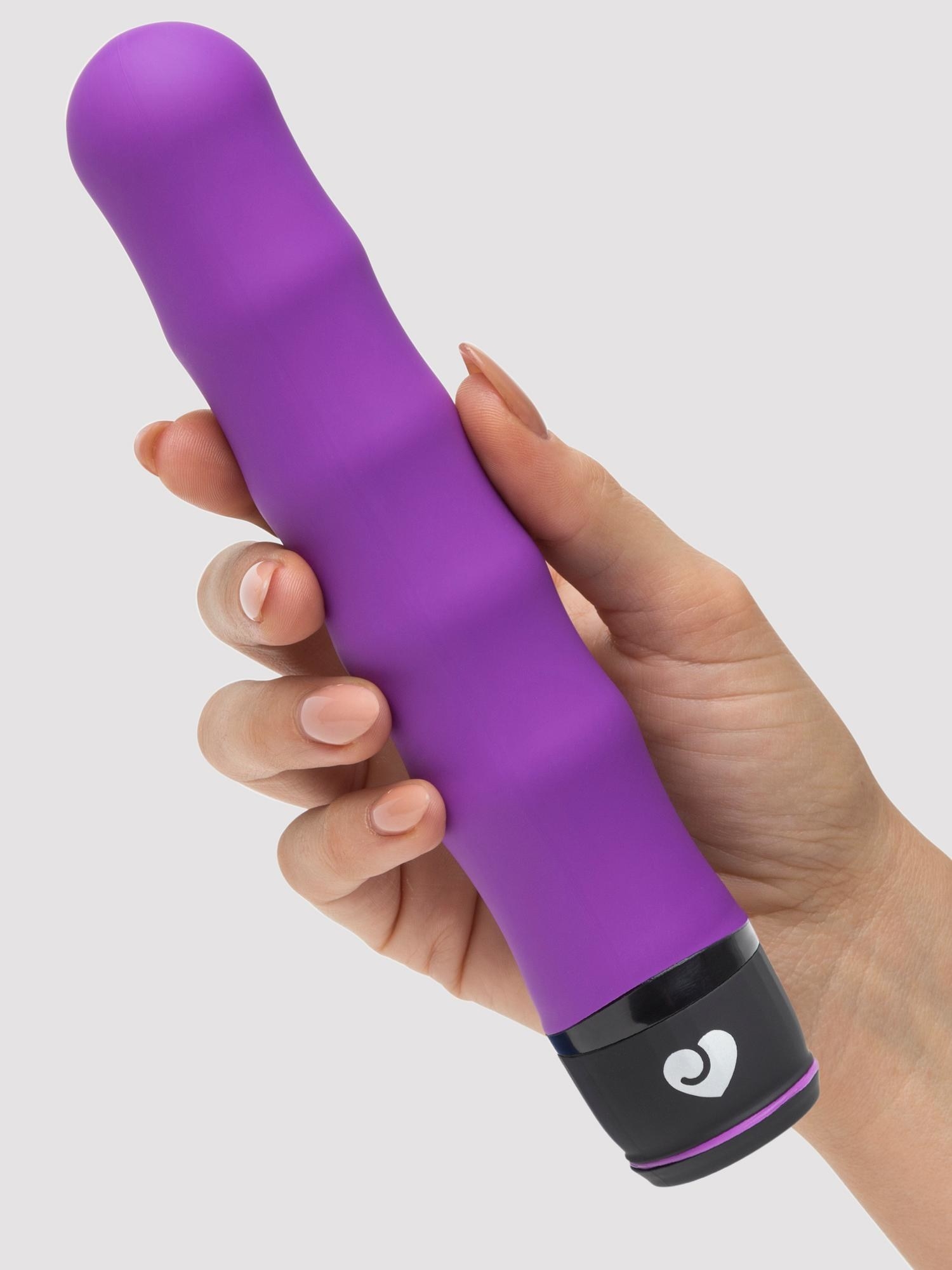 Hand holding the ridged purple vibe