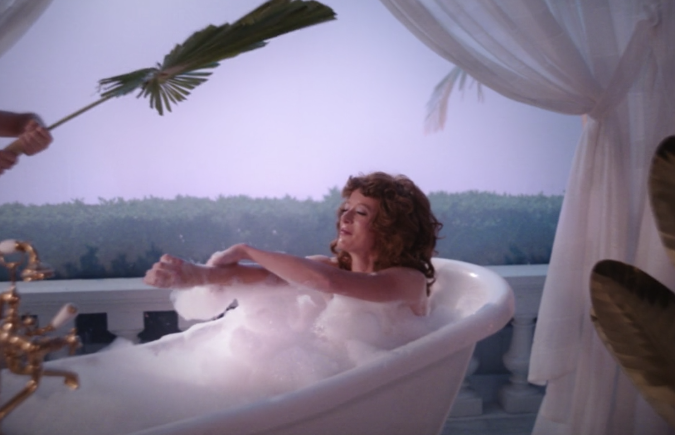 A woman taking a bath in the Hydra Soak commercial 