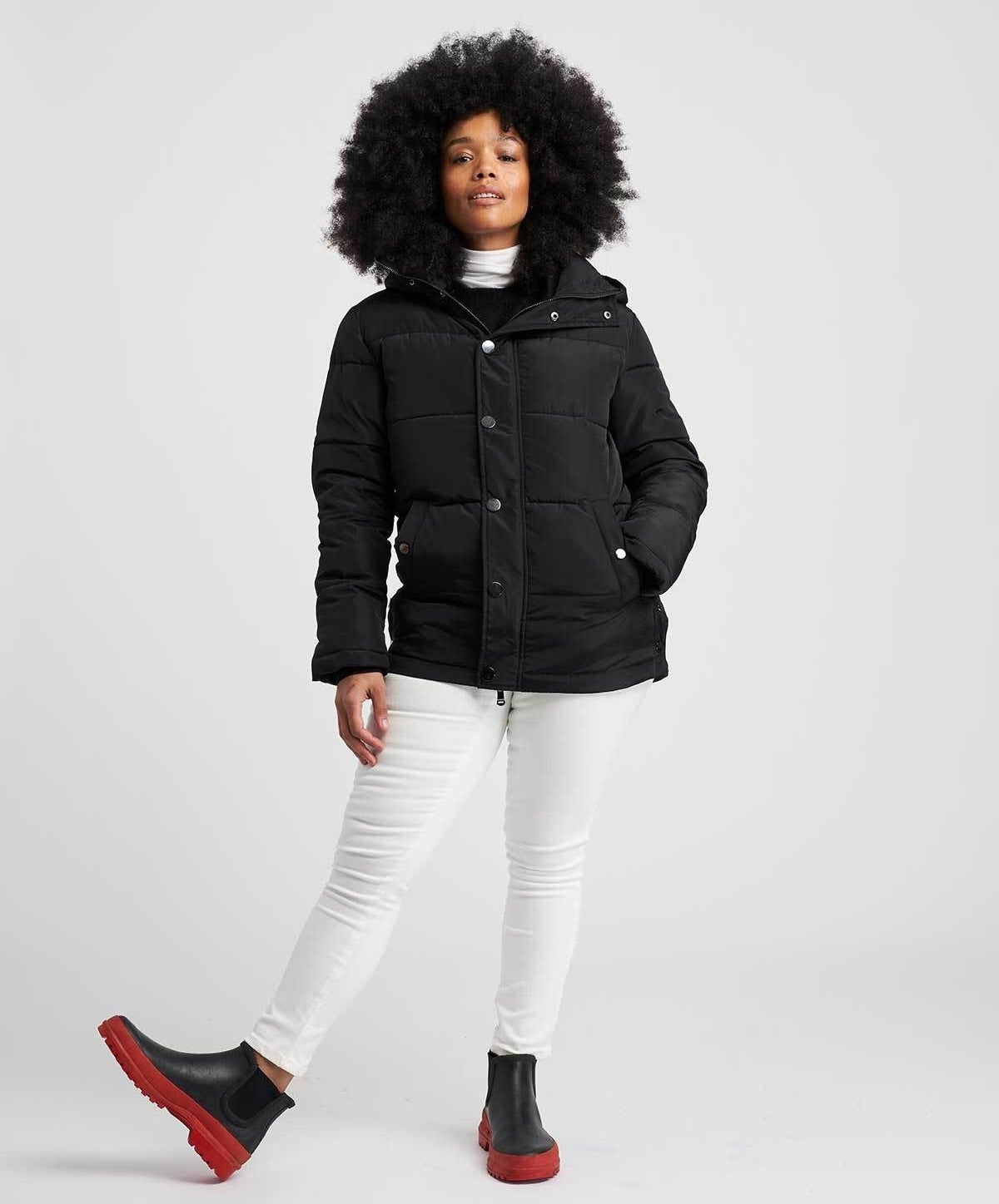 model in black short hooded puffer coat